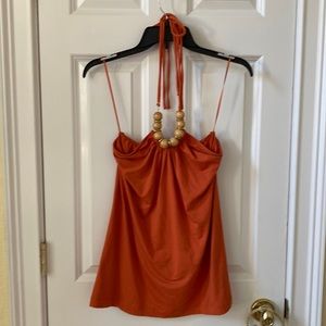 The Limited Orange Halter with Thin straps and large tan bead with gold accents.